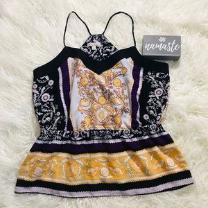 Eva Mendes sleeveless blouse.